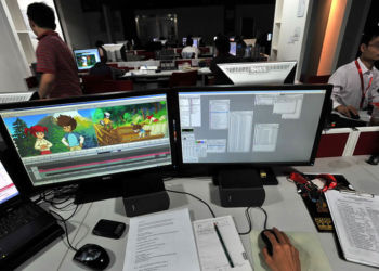 epa01893189 An cartoon artist works at a computer graphics company making cartoon programmes in Wuhan in central China's Hubei province 10 October 2009. The company made some 13 million euros in 2008, but nearly 70% of that came from outsourcing jobs despite the government's policy to encourage the domestic cartoon industry. EPA/ZHOU CHAO